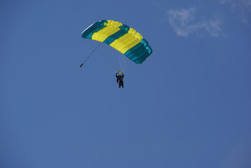 Parachute tandem in the blue sky