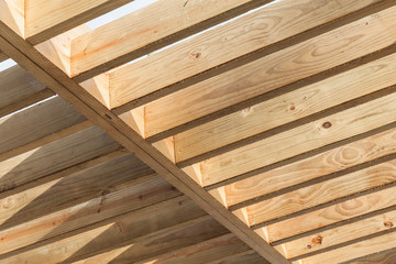 Wooden beams in a row. Sunshade ceiling structure