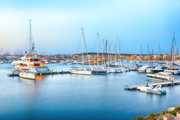 Fototapeta na wymiar Fantastic evening view of Alghero port