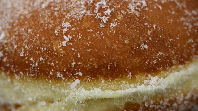 Fresh made Berliner Doughnuts rotating on a plate (seamless loopable)