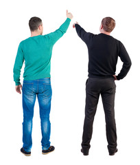 Back view two man in sweater showing thumb up.