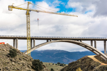 Crane and scaffolding structures intended for the construction of a bridge in Spain