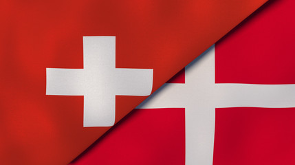 The flags of Switzerland and Denmark. News, reportage, business background. 3d illustration