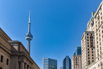 Fototapeta na wymiar Emblematic buildings of the Toronto skyline, on a sunny day with blue skies. Toronto, Ontario, Canada
