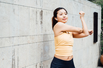 young asian beauty woman doing exercise outdoors
