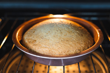 plant-based food, vegan banana bread with flax seeds cinnamon and maple syrup baking in the oven