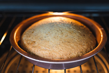 plant-based food, vegan banana bread with flax seeds cinnamon and maple syrup baking in the oven