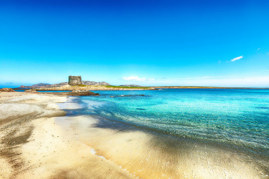 Stunning morning view of Famous La Pelosa beach with Torre della Pelosa.