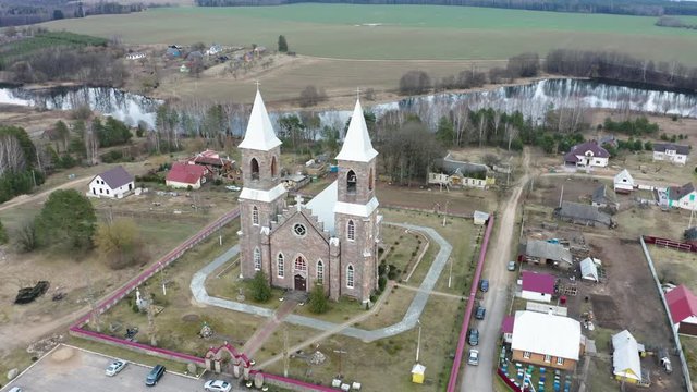 Drone shot on Catholic church of St. Iosif in Rubegevich, Belarus. Aerial view on catholic church architecture.
