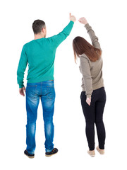 Back view of couple in sweater showing thumbs up.