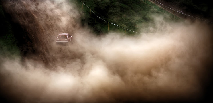 Racing Sports Car In Dust Clubs On The Track , Rally