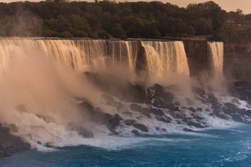 Panorama of the waterfall on the U.S. side at sunset. Concept of nature and travel. Niagara Falls, Canada. United States of America