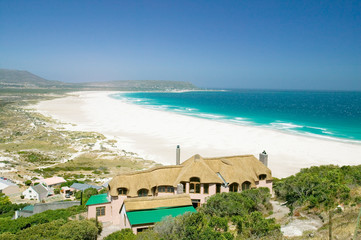 Fototapeta na wymiar North of Hout Bay, Southern Cape Peninsula, outside of Cape Town, South Africa, a beautiful home with view of Atlantic Ocean and white sand beaches