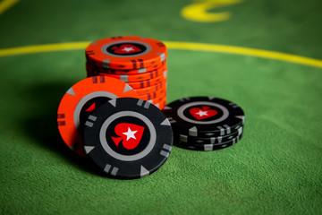 Black and red poker chips in the game