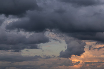 Epic dramatic Storm sky on sunset, dark blue grey cumulus clouds background texture