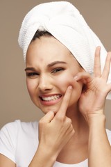 young woman with towel on head