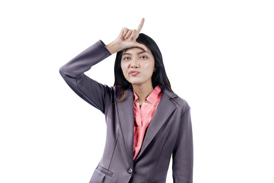 Asian businesswoman showing loser sign