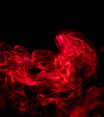 Red smoke on black background