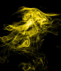 Obraz premium Yellow smoke on black background