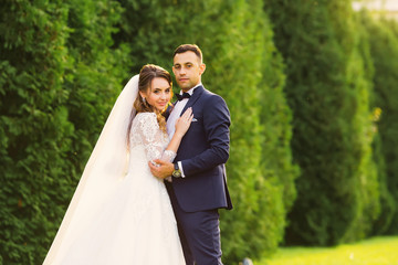 the bride who has bent her back and the groom who wants to kiss