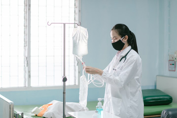 a female doctor showing how to dialysis