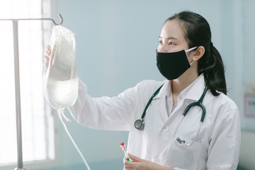 a female doctor showing how to dialysis