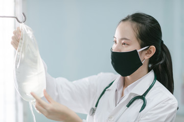 a female doctor showing how to dialysis