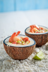 Enjoy your Tom Yum soup on white stones with seashells