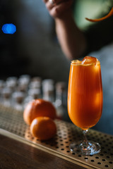 Garibaldi cocktail decorated with mandarin orange zest.