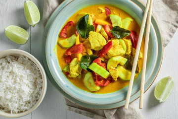 Homemade yellow curry with kaffir leaves, coconut milk and chicken