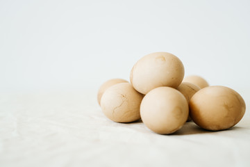 Seven Easter eggs trendy pastel colored with cracks lie on the table on a light tablecloth. minimal style. easter concept.copy space for text