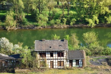 Old ruined half-timbered house at mosel river Germany