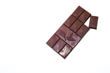 Beautiful milk chocolate lies on a white background