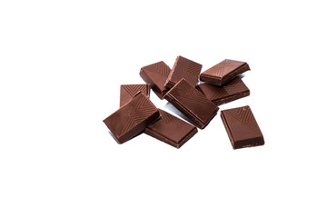 Beautiful milk chocolate lies on a white background