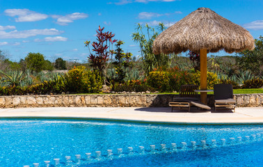 pool scene  at hotel on a sisal agave plantation
