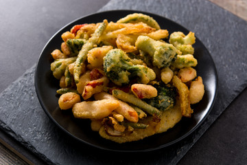 Japanese vegetable tempura on black background	