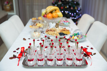 Armudu cups for the engagement ceremony . tea in eastern armudu glass on the silver salver on the white tablecloth, Arabic, Turkish, Azerbaijani customs . armudu cups .