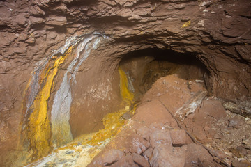 Underground bauxite mine tunnel with collapsed roof