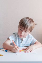 Beautiful creative boy is creativity and the artist in an online drawing 
paints lesson. Childrens creativity. The concept of distance learning online school for the period of global quarantine. 