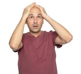 Shocked 40 years old bald man in t-shirt isolated