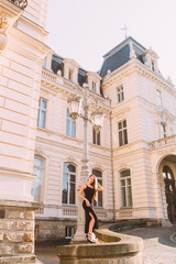 Fototapeta na wymiar building with beautiful architecture and girl in black dress nea