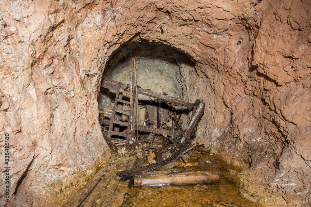 Sticker underground bauxite mine tunnel with collapsed toilet shithouse