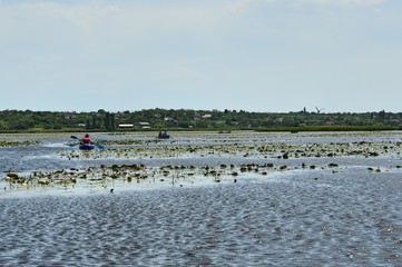 People on a boat on the river