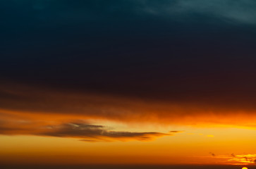 Fantastic dark thunderclouds at sunrise