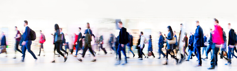 Beautiful motion blur of walking people. Early morning rush hours, busy modern life concept.