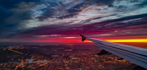 Early morning shot of Amsterdam from a plane with dramatic sky