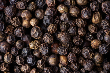 Closeup heap a whole pepper seeds.