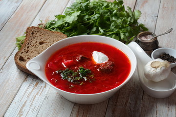 Traditional Ukrainian Russian borscht . Bowl of red beet root soup borsch with white cream . Beet Root delicious soup . Traditional Ukrain food cuisine 