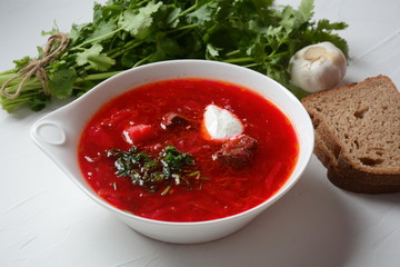 Traditional Ukrainian Russian borscht . Bowl of red beet root soup borsch with white cream . Beet Root delicious soup . Traditional Ukrain food cuisine 