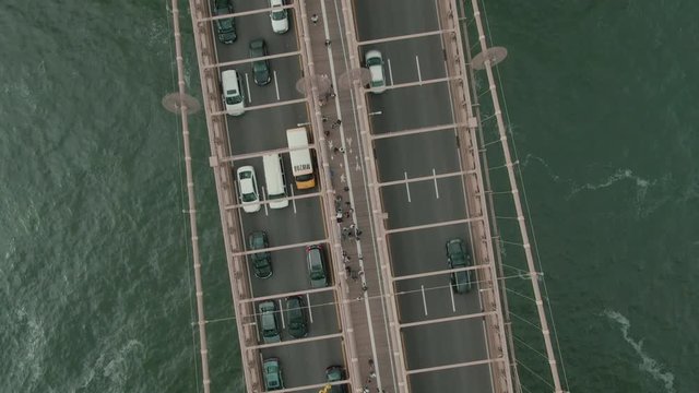 Aerial top shot. Camera rotation view of the traffic on the Brooklyn Bridge.